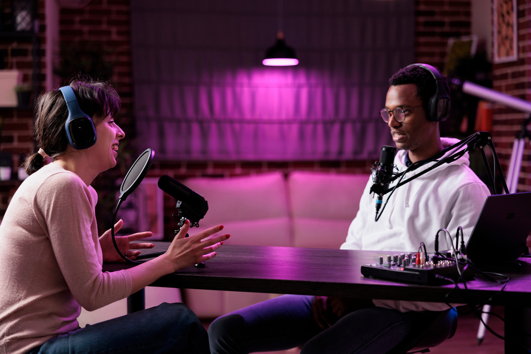 Content creator interviewing woman on online podcast